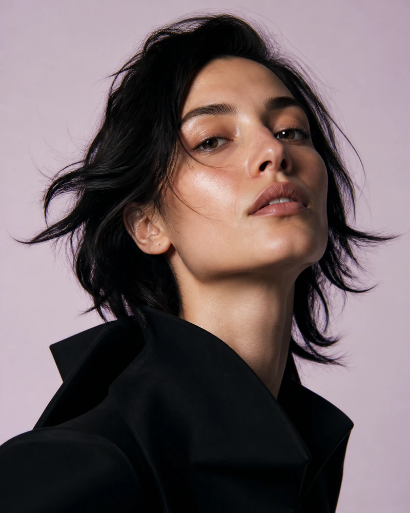 Synthetic portrait: dark hair and a sculptural black collar against pale lavender